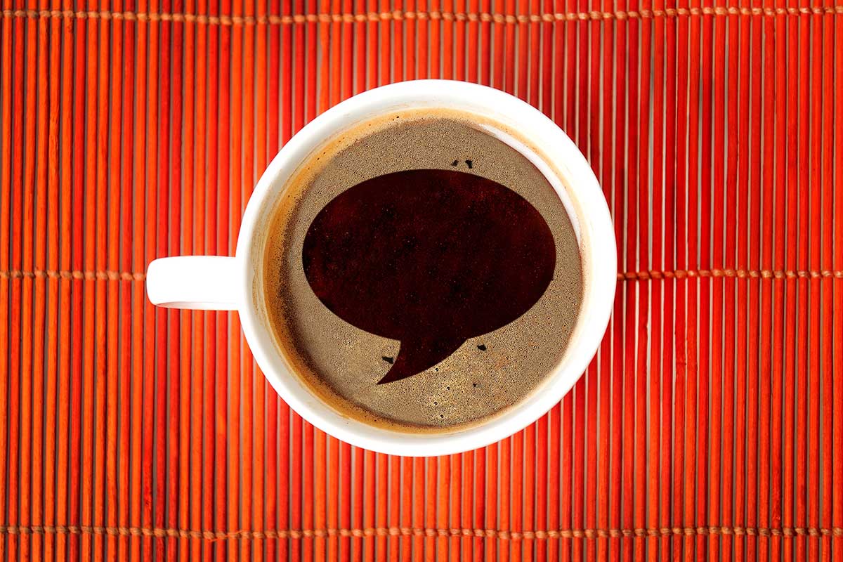 Top down view of coffee mug with speech bubble graphic within the cup for Coffee with the Principal event